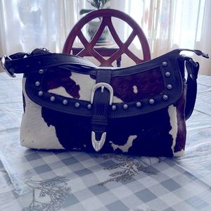 Vintage American West hair on Hyde leather handbag.